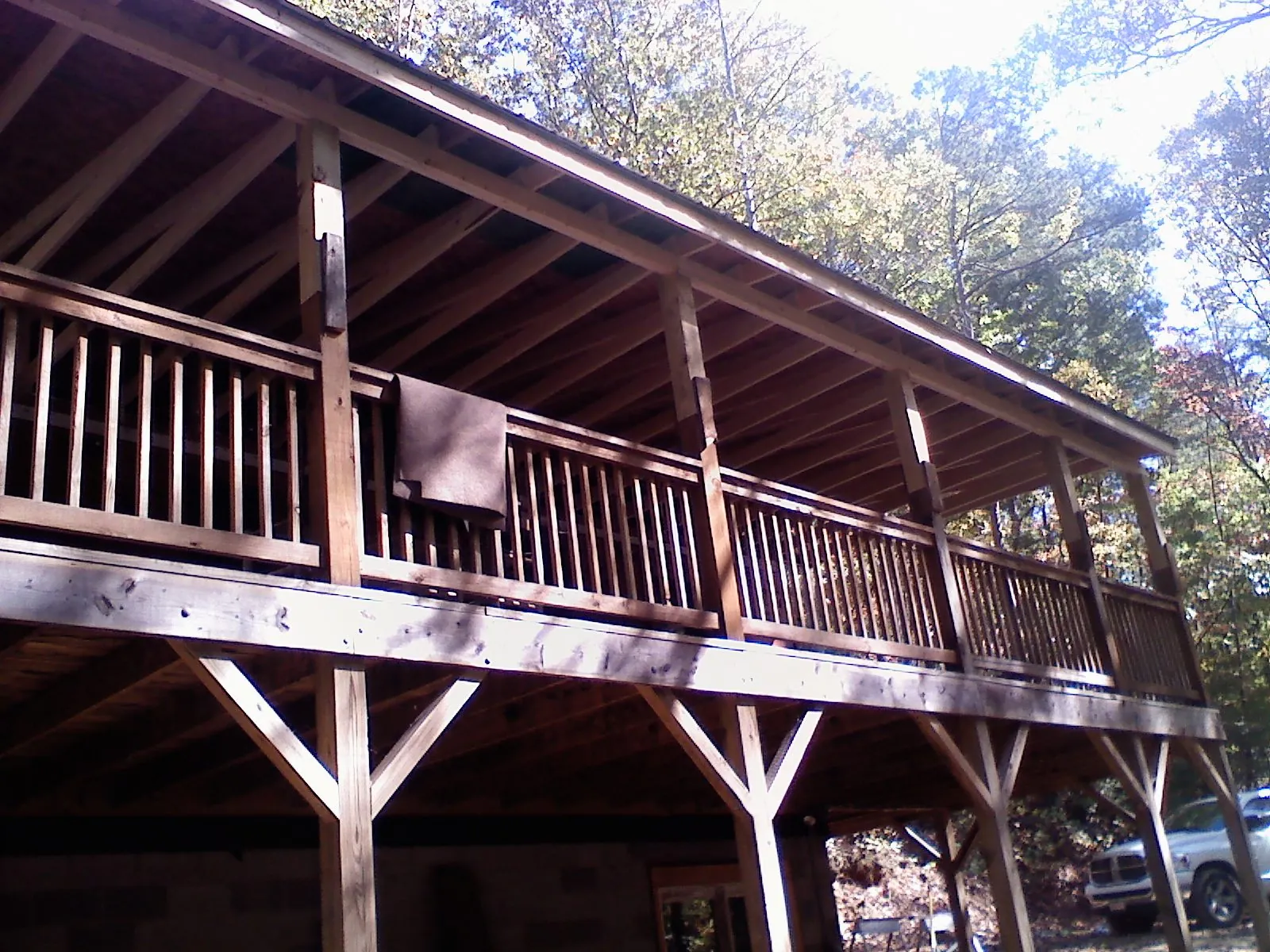 Timber framing under a new elevated porch and deck — Roof Leak Repair in Ogdensburg by Roofing Brothers